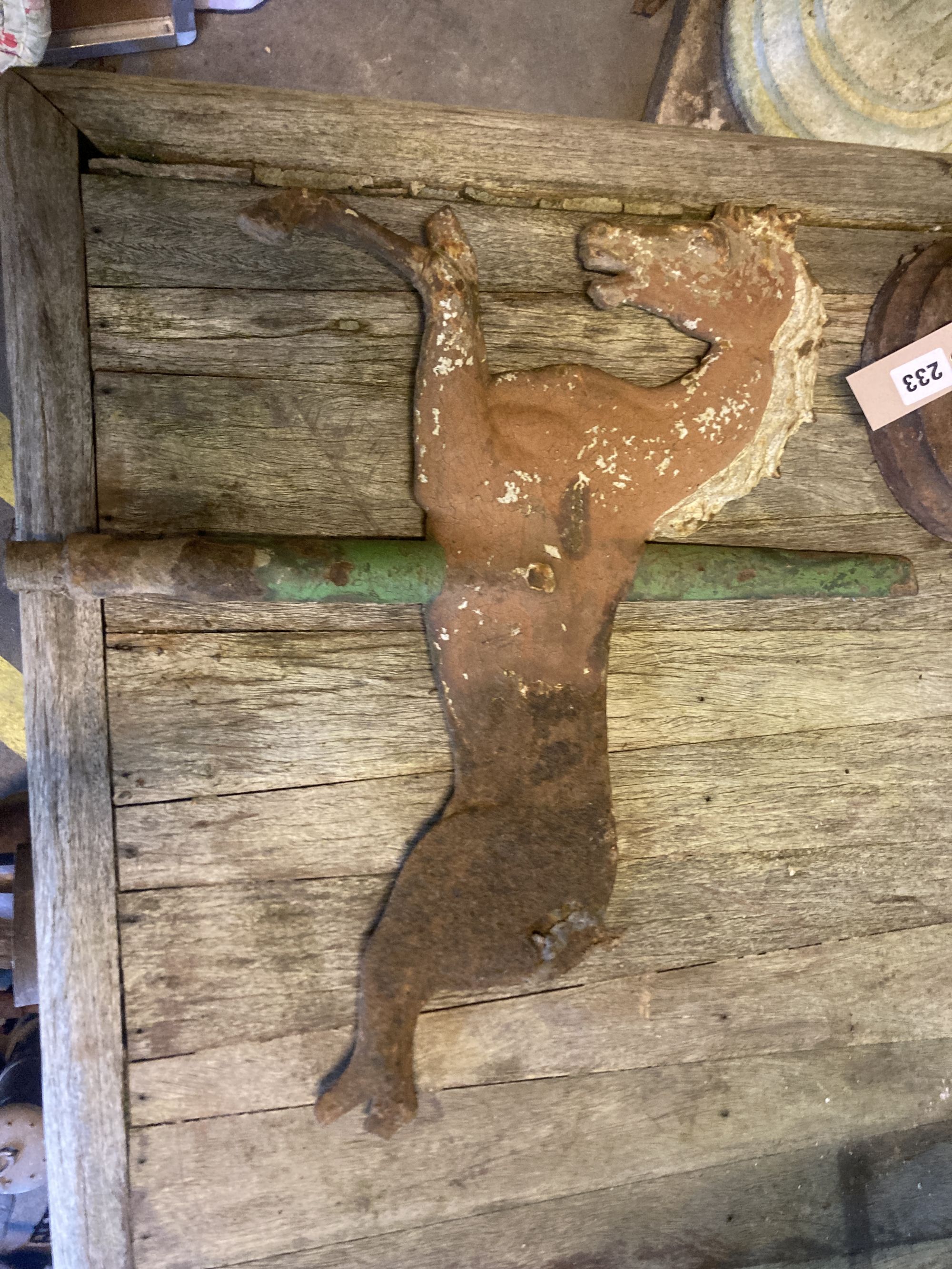 A cast iron doorstop together with a painted cast iron horse weather vase, height 50cm